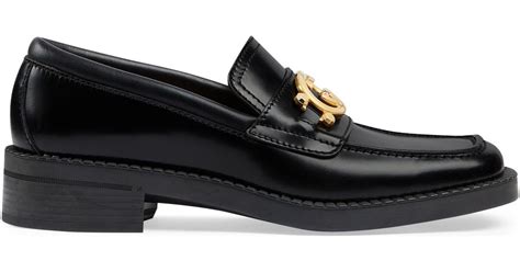 gucci g-locking loafers.